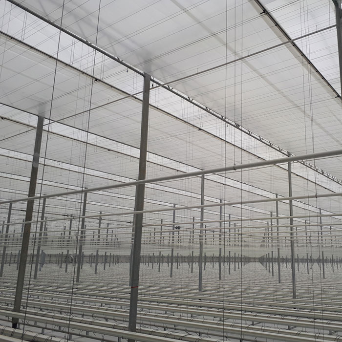 Commercial greenhouse shade systems and shade system designs